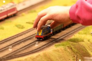 Hand touching model train