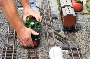 Hands on Model Railroad Train and Tracks
