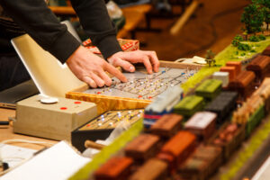 Train Hobbyist Controlling Model Train Track